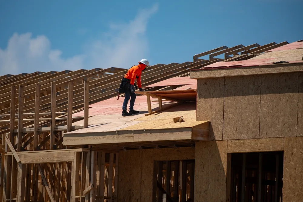 roofer works on a construction site