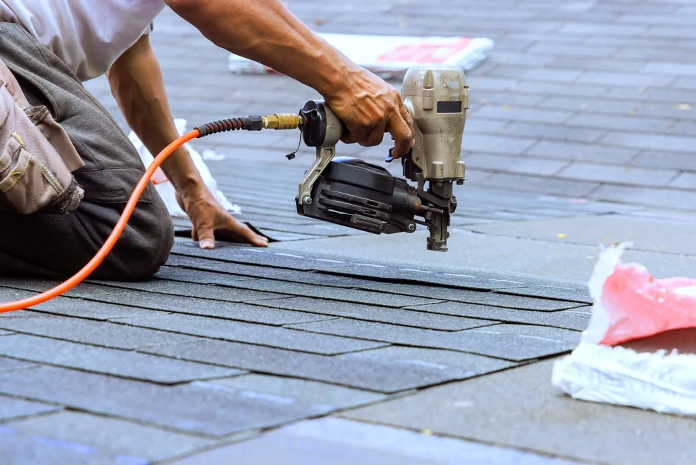 closeup roofer nail gun