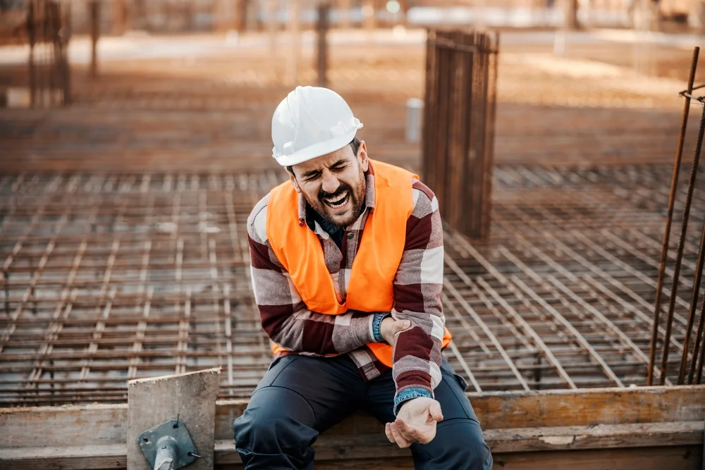 Construction worker in pain after an accident, construction accident law firm