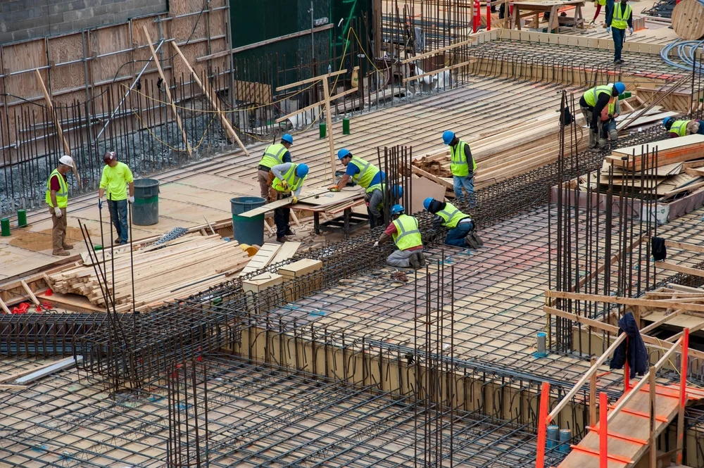 Construction workers work in a new building construction in New York City